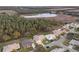 Aerial view of a house with a pool, located near a tranquil lake at 6525 Borg St, Leesburg, FL 34748