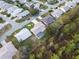 Aerial view of a house with a screened-in pool and a large yard at 6525 Borg St, Leesburg, FL 34748