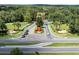 Aerial view of the community entrance with lush landscaping and cars at 6525 Borg St, Leesburg, FL 34748