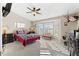 Spacious main bedroom with bay window and a ceiling fan at 6525 Borg St, Leesburg, FL 34748