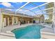 Inviting screened pool and spa with outdoor seating at 6525 Borg St, Leesburg, FL 34748