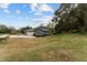 Spacious backyard with a basketball hoop and boat storage at 7237 Edmund Ct, Mount Dora, FL 32757