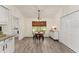 Small dining area with wood table and black metal chairs at 7237 Edmund Ct, Mount Dora, FL 32757