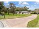 Single-story home with landscaped yard and circular driveway at 7237 Edmund Ct, Mount Dora, FL 32757