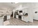 Modern kitchen with white cabinets and granite countertops at 7237 Edmund Ct, Mount Dora, FL 32757