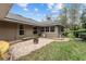 Brick patio with fire pit and kayaks for storage at 7237 Edmund Ct, Mount Dora, FL 32757