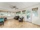 Sunroom with tiled floor, multiple windows, and a door leading outside at 7237 Edmund Ct, Mount Dora, FL 32757