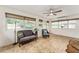 Relaxing sunroom with tiled floors, windows, and comfortable seating at 7237 Edmund Ct, Mount Dora, FL 32757