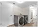 Updated laundry room with modern washer and dryer at 7470 Lake Marsha Dr, Orlando, FL 32819