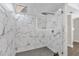 Modern shower with marble-look walls and glass enclosure at 7470 Lake Marsha Dr, Orlando, FL 32819