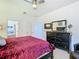 Large bedroom with king bed, ensuite bathroom access, and ample closet space at 804 Orange Cosmos Blvd, Davenport, FL 33837