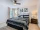 King-size bedroom with ceiling fan and ensuite bathroom at 804 Orange Cosmos Blvd, Davenport, FL 33837