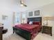 Spacious bedroom with a king-size bed and ensuite bathroom at 804 Orange Cosmos Blvd, Davenport, FL 33837