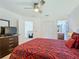 Bedroom with a queen bed and access to a loft at 804 Orange Cosmos Blvd, Davenport, FL 33837