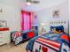 Mickey Mouse themed bedroom with twin beds at 804 Orange Cosmos Blvd, Davenport, FL 33837