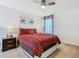 Bright bedroom with queen bed and ceiling fan at 804 Orange Cosmos Blvd, Davenport, FL 33837