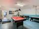 Game room with pool table, foosball, and access to another room at 804 Orange Cosmos Blvd, Davenport, FL 33837