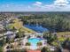 Aerial view of community pool, spa, and lake at 804 Orange Cosmos Blvd, Davenport, FL 33837