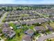 Aerial view of a residential neighborhood with many homes at 810 Maplebrook Loop, Apopka, FL 32703