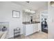 Double vanity bathroom with granite countertops and modern fixtures at 810 Maplebrook Loop, Apopka, FL 32703