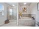 Spa-like bathroom with a soaking tub and a separate walk-in shower at 810 Maplebrook Loop, Apopka, FL 32703