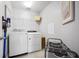 Convenient laundry room with washer, dryer, and shelving at 810 Maplebrook Loop, Apopka, FL 32703