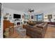 Relaxing living room with sectional sofa and hardwood floors at 810 Maplebrook Loop, Apopka, FL 32703