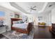 Main bedroom with a king-size bed, a large rug, and an ensuite bathroom at 810 Maplebrook Loop, Apopka, FL 32703