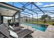 Inviting pool area with lounge chairs and a screened enclosure at 810 Maplebrook Loop, Apopka, FL 32703