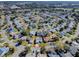 Aerial view showing a house's location within a residential neighborhood at 830 Cortez Ave, The Villages, FL 32159