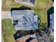 An aerial view showcasing a single-story house with a sizable backyard at 830 Cortez Ave, The Villages, FL 32159