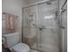 Bathroom with walk-in shower and built-in shower seat at 830 Cortez Ave, The Villages, FL 32159