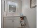 Clean bathroom with vanity, mirror and under-sink storage at 830 Cortez Ave, The Villages, FL 32159