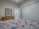 Bedroom with a comfortable bed, large closet, and access to a bathroom at 830 Cortez Ave, The Villages, FL 32159