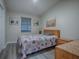 Guest bedroom with wood flooring and a comfy bed at 830 Cortez Ave, The Villages, FL 32159