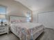 Spacious Primary bedroom with large bed and en-suite bathroom at 830 Cortez Ave, The Villages, FL 32159