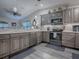 Updated kitchen with stainless steel appliances and granite countertops at 830 Cortez Ave, The Villages, FL 32159