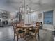 Open concept kitchen with modern appliances and wood cabinets at 830 Cortez Ave, The Villages, FL 32159