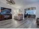 Living room with hardwood floors and a built-in home office at 830 Cortez Ave, The Villages, FL 32159