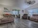 Spacious living room with comfortable seating and hardwood floors at 830 Cortez Ave, The Villages, FL 32159
