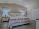 Spacious main bedroom with a comfortable bed and plenty of natural light at 830 Cortez Ave, The Villages, FL 32159