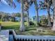 Landscaped backyard with lake access at 908 N Lakeshore Blvd, Howey In The Hills, FL 34737