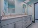 Elegant bathroom with double vanity and granite countertop at 908 N Lakeshore Blvd, Howey In The Hills, FL 34737