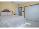 Bright bedroom with a comfortable bed and built-in closet at 908 N Lakeshore Blvd, Howey In The Hills, FL 34737