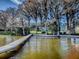 Wooden walkway leading to a waterfront dock at 908 N Lakeshore Blvd, Howey In The Hills, FL 34737