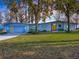 Modern waterfront home with a light blue exterior at 908 N Lakeshore Blvd, Howey In The Hills, FL 34737