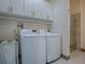 Bright laundry room with washer and dryer at 908 N Lakeshore Blvd, Howey In The Hills, FL 34737