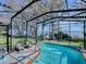 Relaxing pool area with lake view at 908 N Lakeshore Blvd, Howey In The Hills, FL 34737