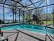 Enjoy this refreshing pool with a screened enclosure and gorgeous water views at 908 N Lakeshore Blvd, Howey In The Hills, FL 34737