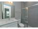 Clean bathroom with white vanity and tiled shower at 10049 Ballast Dr, Orlando, FL 32827